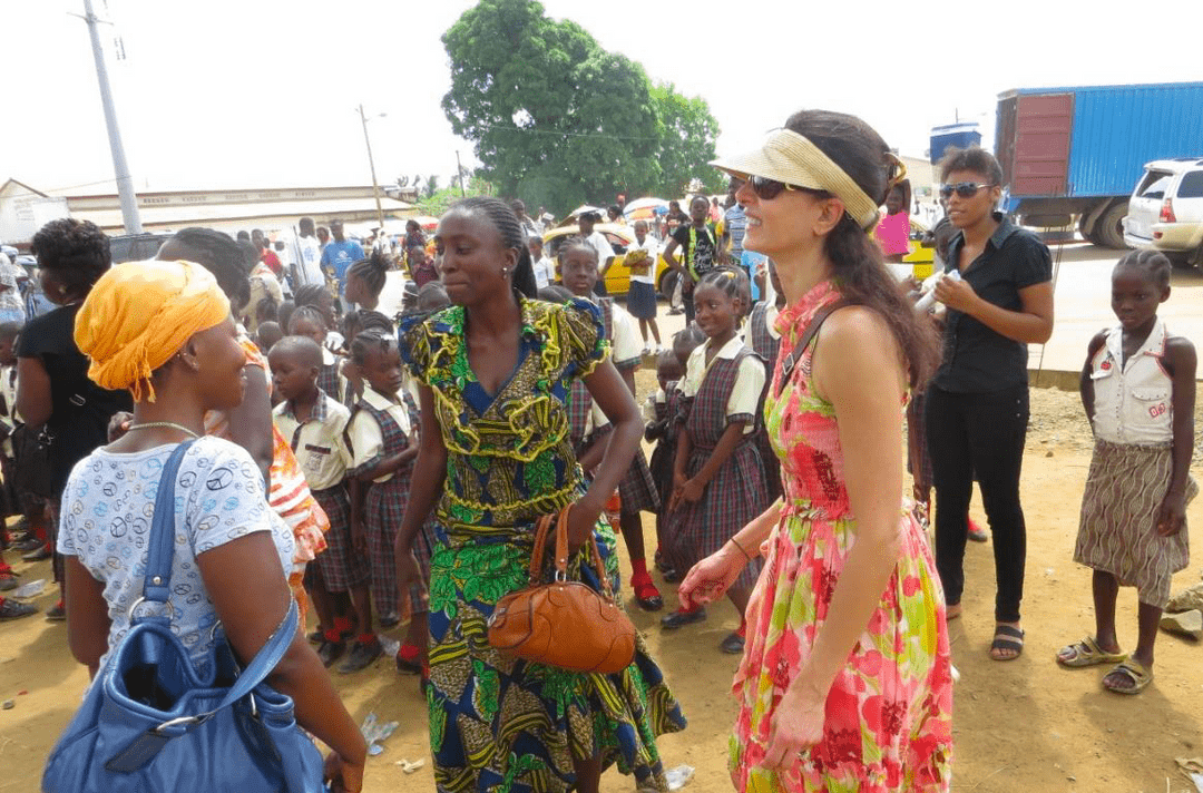 Fariba outside with fellow teachers and others.