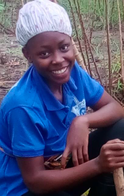 A woman smiling in the field