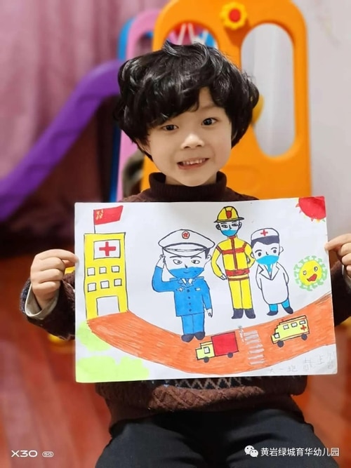 A student with their drawing.