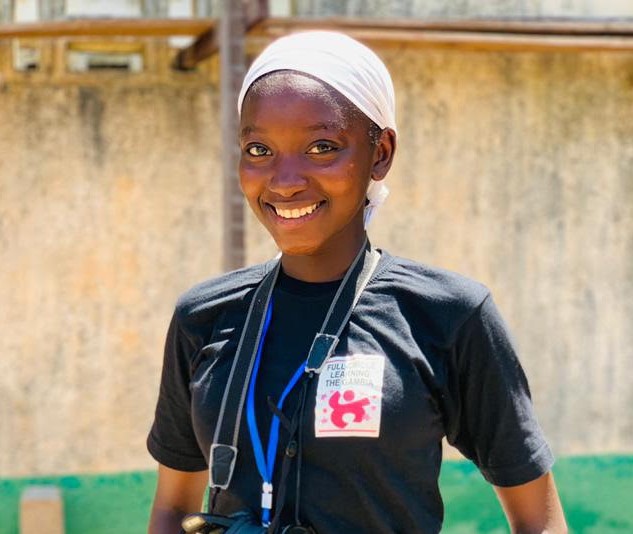 A girl in Gambia with a Full circle learning shirt.